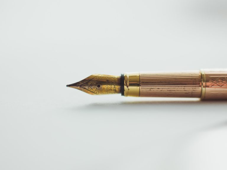 Brass fountain pen on white background. Image by Art Lasovsky.
